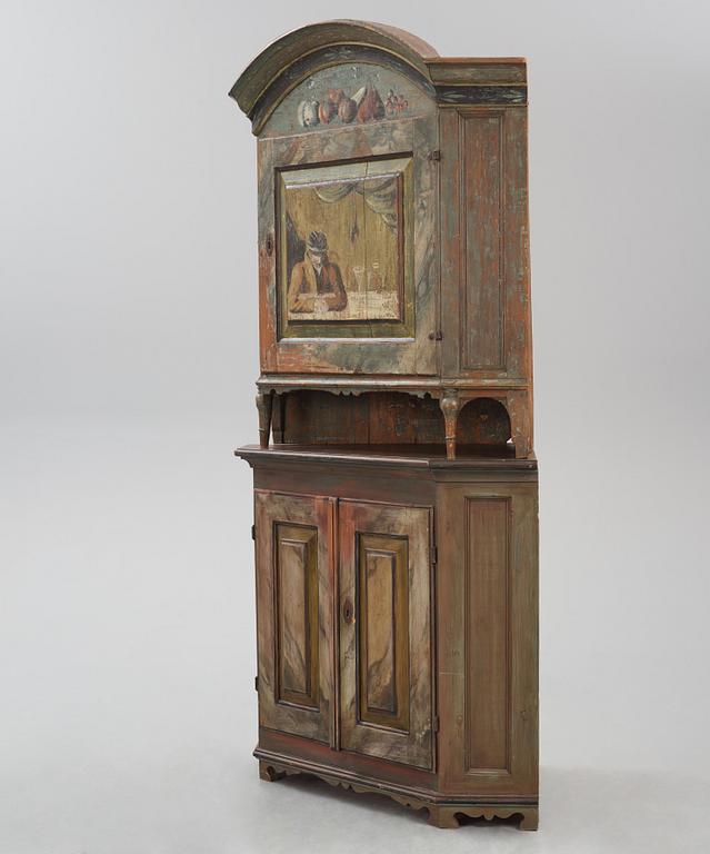 A Swedish polychrome-painted corner cabinet attributed to J. Bäckström (1773-1837).