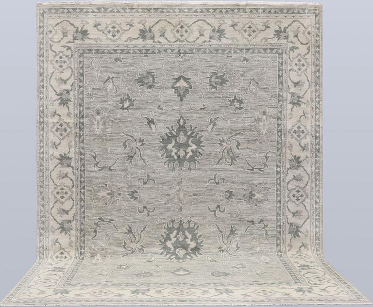 A rug, Ziegler design, approx. 368 x 279 cm.