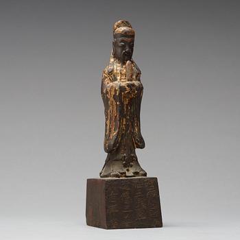 A copper alloy figure of a daoist dignitary, late Ming dynasty (1368-1644).