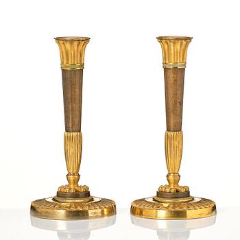 A pair of Empire candelsticks.