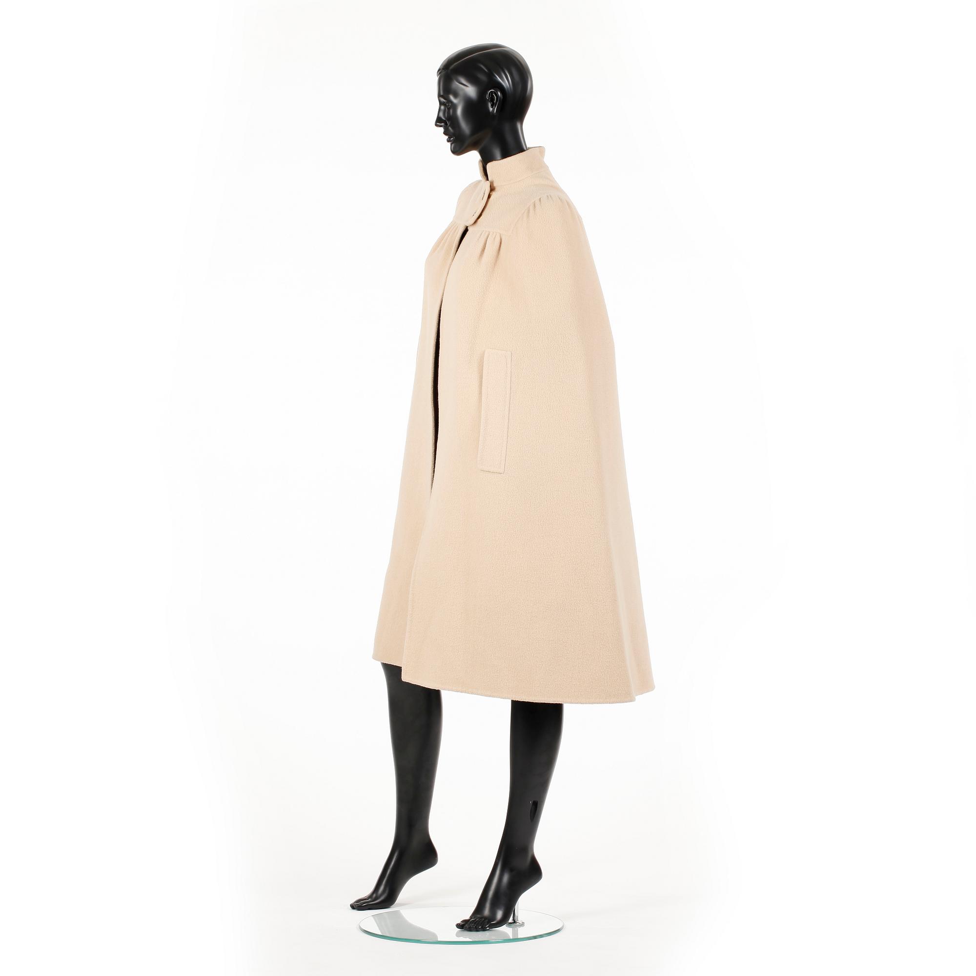 SALVATORE FERRAGAMO, a beige wool cape.