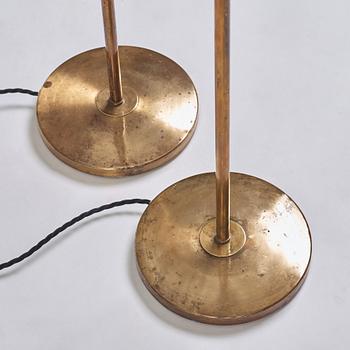 A pair of Swedish Modern brass uplights, 1940's.