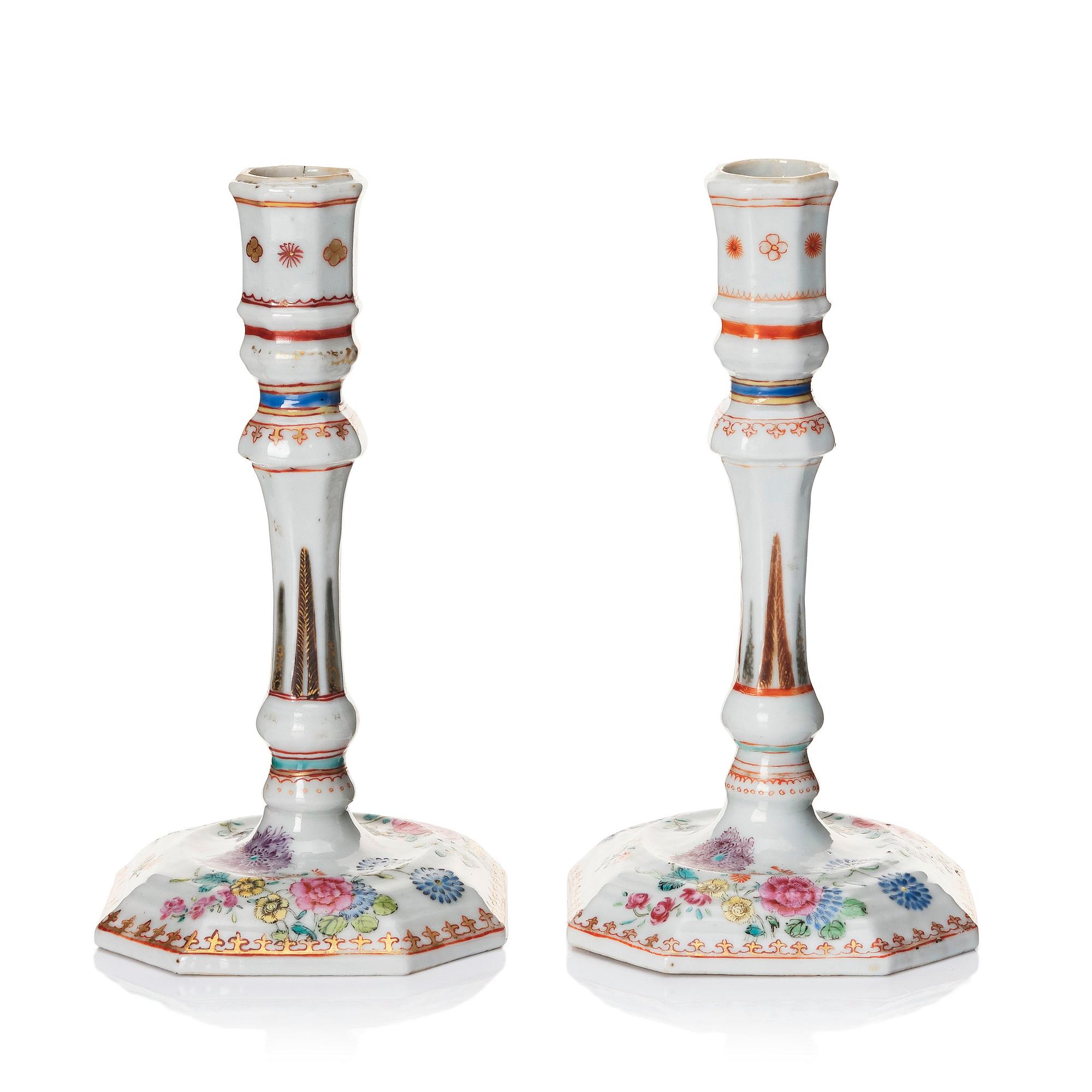 A pair of famille rose candles sticks, Qing dynasty, Qianlong (1736-95).