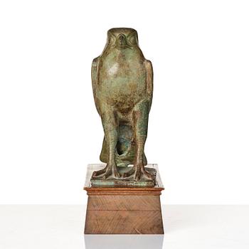 A fine and large Egyptian bronze figure of Horus the falcon, presumably late period Dynasty XXVI, (663-525 B.C.).