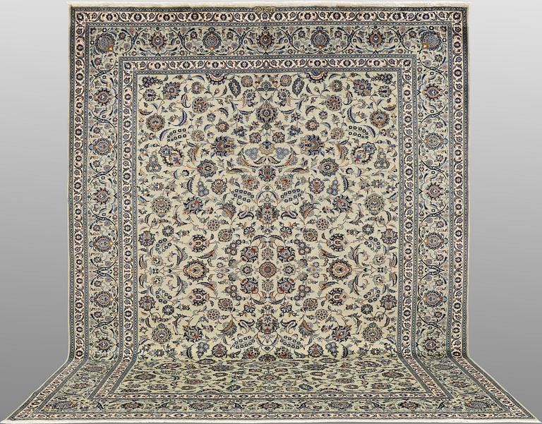 A Keshan carpet, signed, approx. 398 x 301 cm.