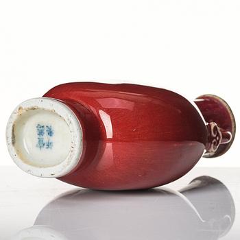 A sang de boef glazed moon flask, Qing dynasty, circa 1900.