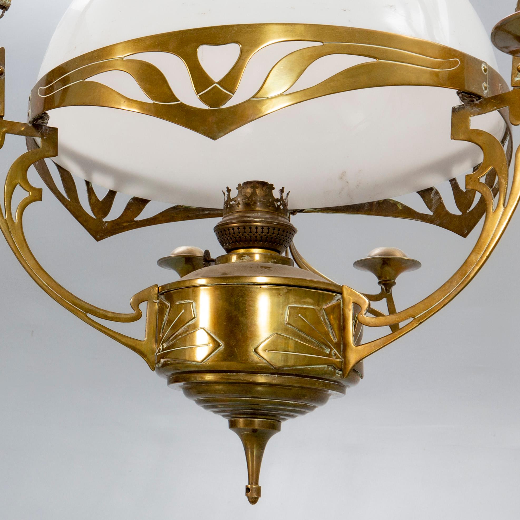 A Jugend brass celing paraffin lamp.