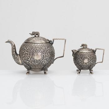 A silver teapot and milk jug, presumably from India, around the turn of the 20th century.