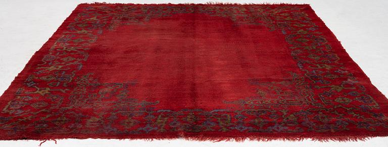 An antique Ushak carpet, West Anatolia, approx. 327 x 250.