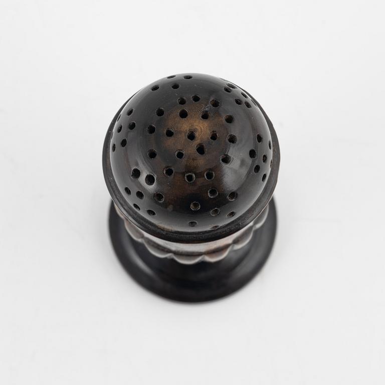 A 18th Century horn saltshaker.