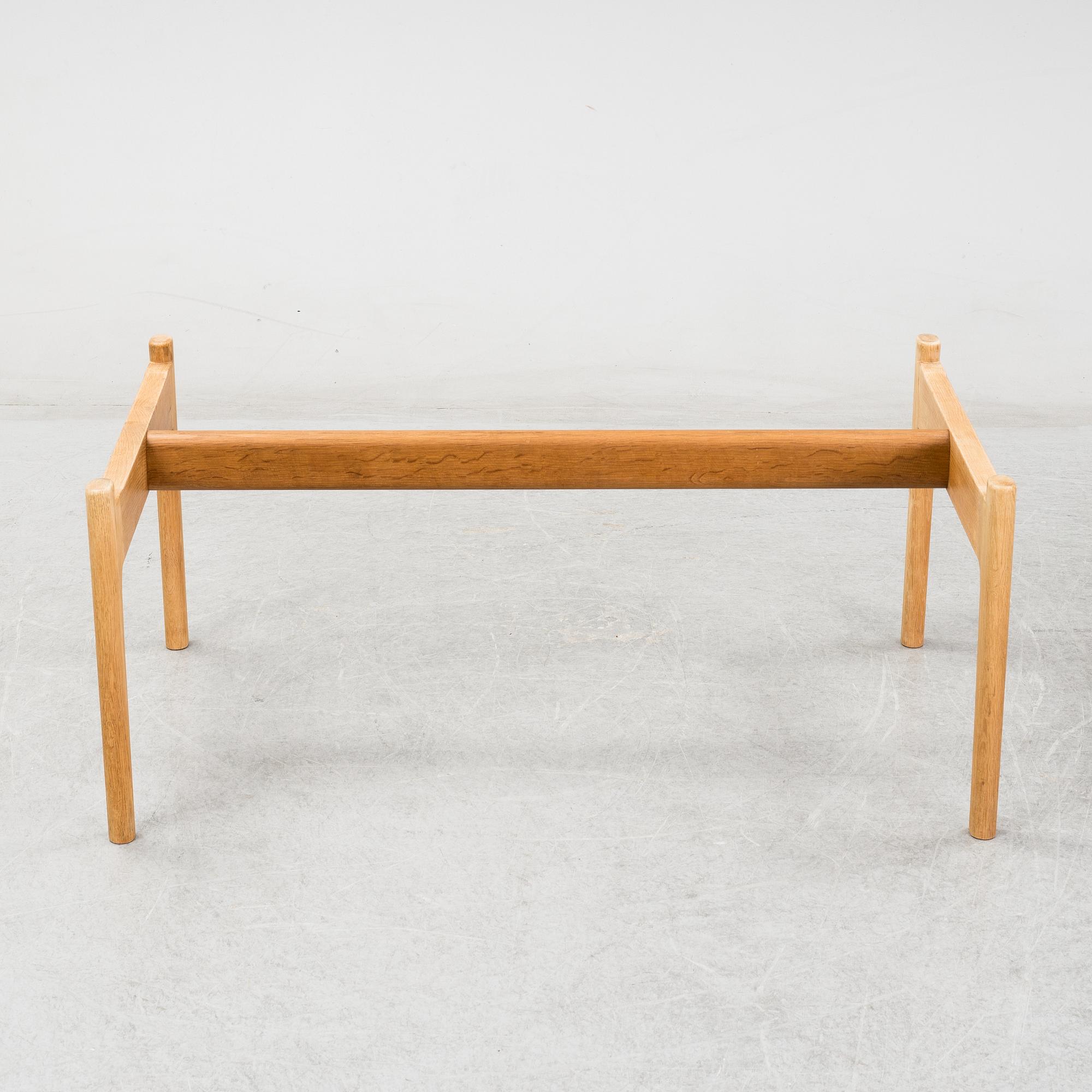 A model JH 575 coffee table by Hans J Wegner for Johannes Hansen.