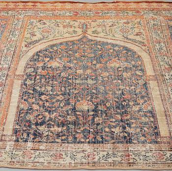 A CARPET FRAGMENT, an antique Indian, Mughal Empire 17th-18th century probably, saf, ca 277 x 136 cm.