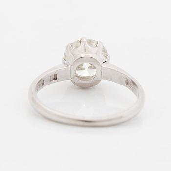 A platinum ring set with an old-cut diamond, by Wiwen Nilsson.