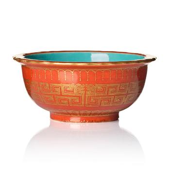 1052. A coral red ground and gilt decorated turquoise enamelled bowl, Qing dynasty, Daoguang mark and period (1821-50).