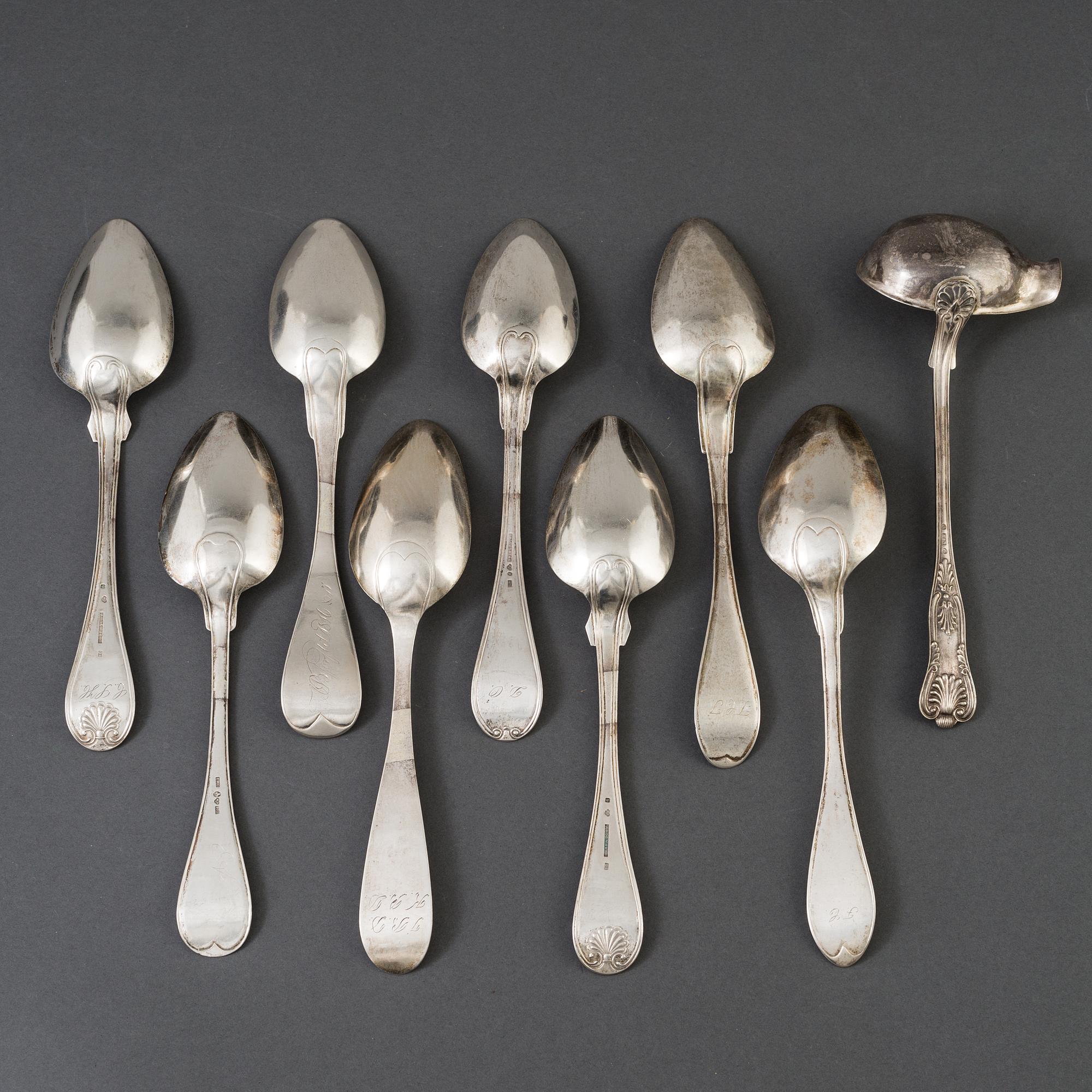 A lot of 8 silver spoons and a silver laddle, among others, P Holmberg, Orebro, 1844.
