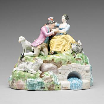 275. A Royal Copenhagen porcelain figure of a courting couple by a well, Denmark late 18th Century.