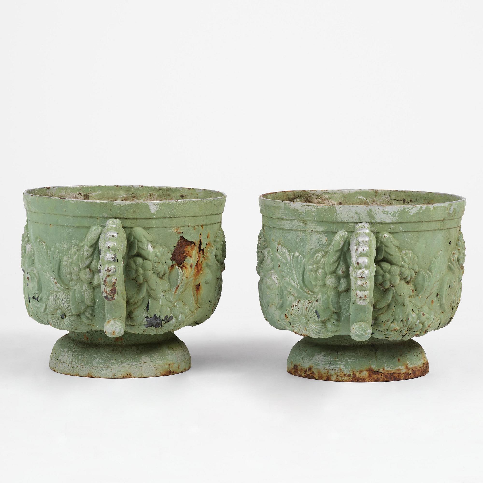 A pair of Swedish cast-iron garden urns, presumably later part 19th century.