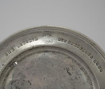 A pewter plate, dated 1787.