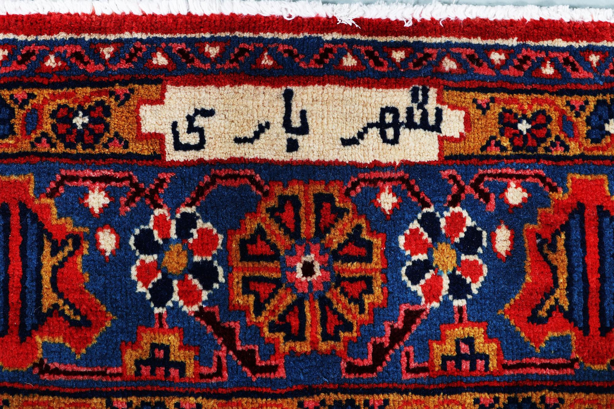 A CARPET, Wiss Signed Sharbani.  327 x 227 cm.