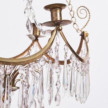 A Gustavian gilt brass and cut glass four-light chandelier, Stockholm, late 18th century.