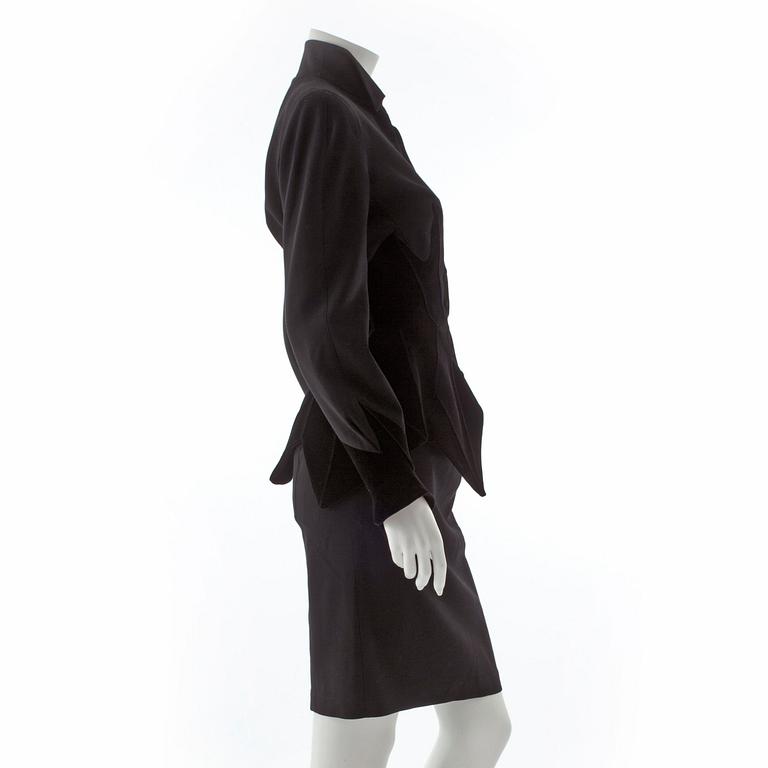 THIERRY MUGLER, a two-piece black wool and velvet dress consisting of jacket and skirt.