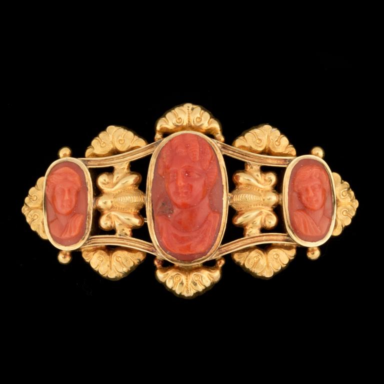 A 19th century carved coral cameo brooch.