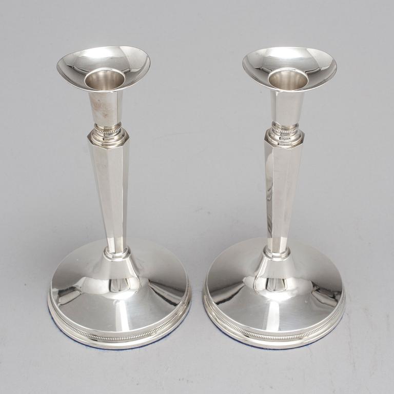 A pair of silver candle sticks by Eric Löfman, Uppsala 1961.