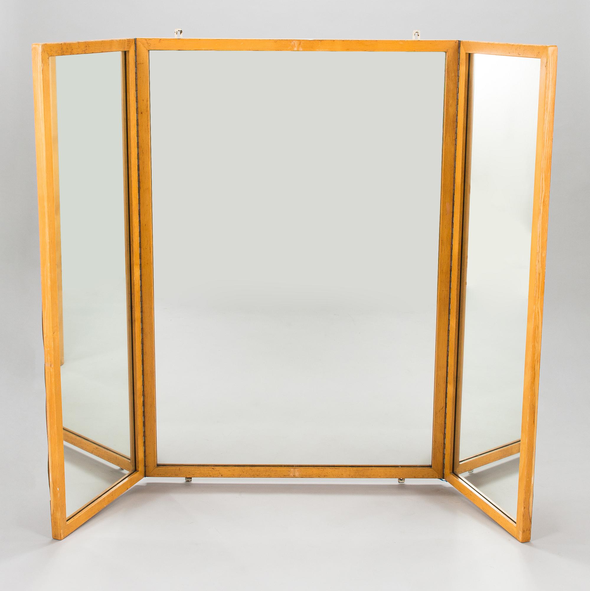 A 1950s three-part dressing mirror.