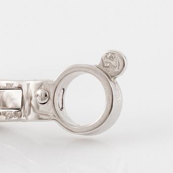 Cartier a pair of earrings platinum set with drop-shaped and round brilliant-cut diamonds.