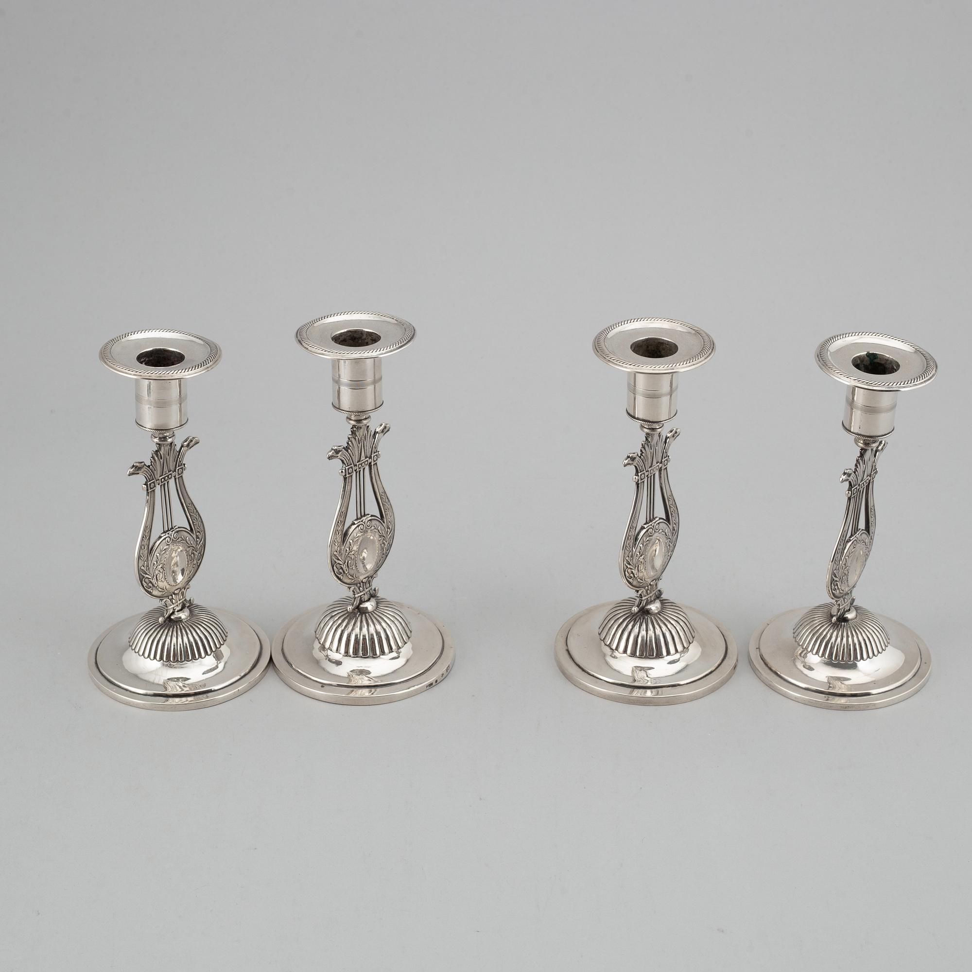 A Swedish 19th century matched set of four silver candlesticks, mark of Johan Petter Grönvall, Stockholm 1824.