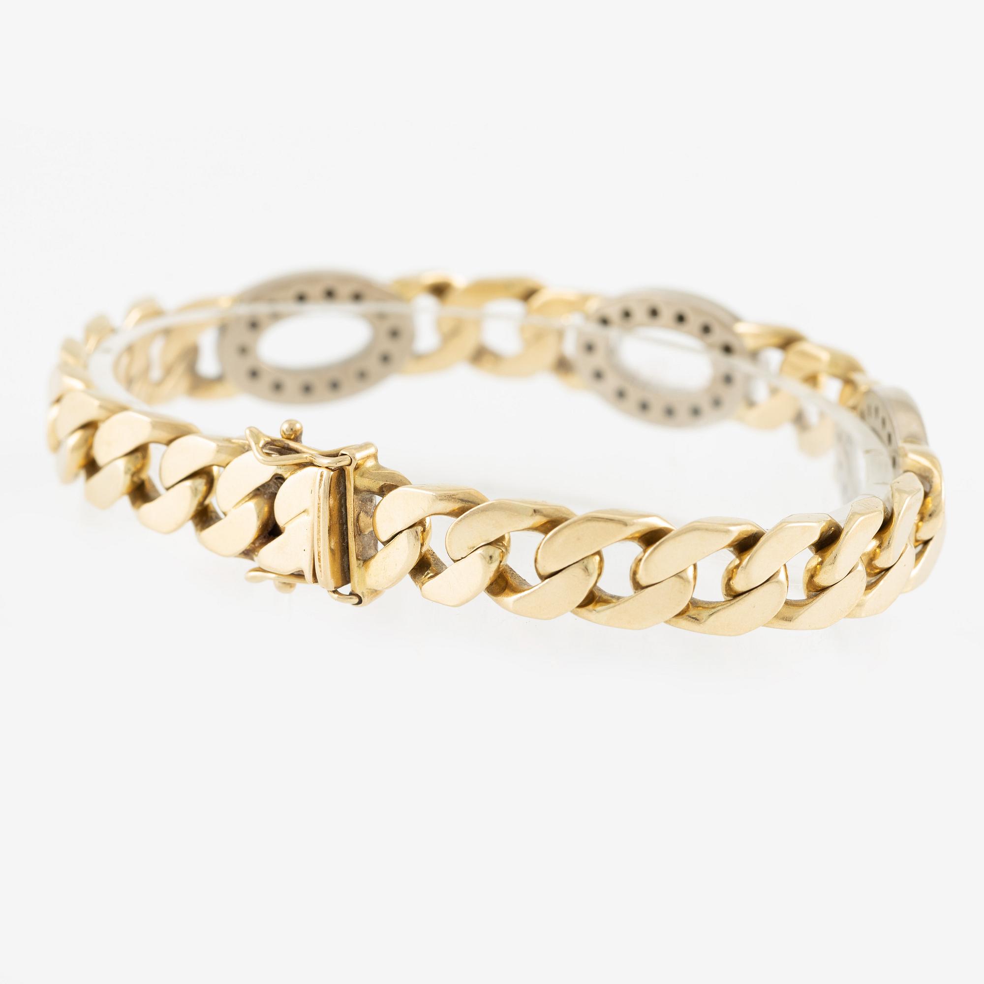 Arm bracelet, 14K gold with brilliant-cut diamonds.