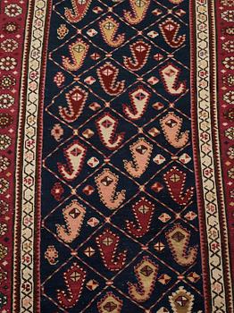 A runner, an antique Karabagh, ca 268,5-278 x 98,5-103,5 cm.