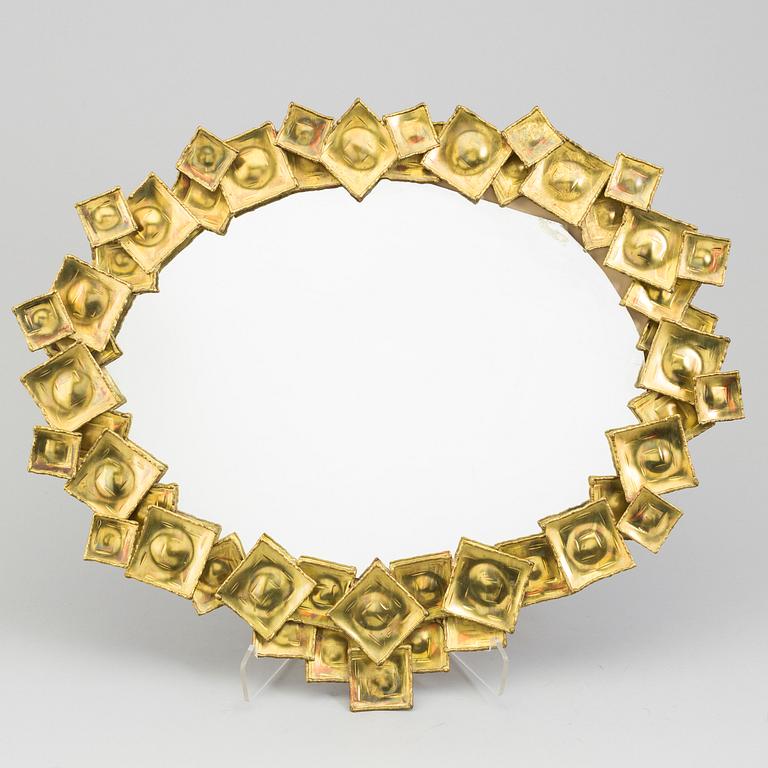 A brass mirror by Claës Giertta.