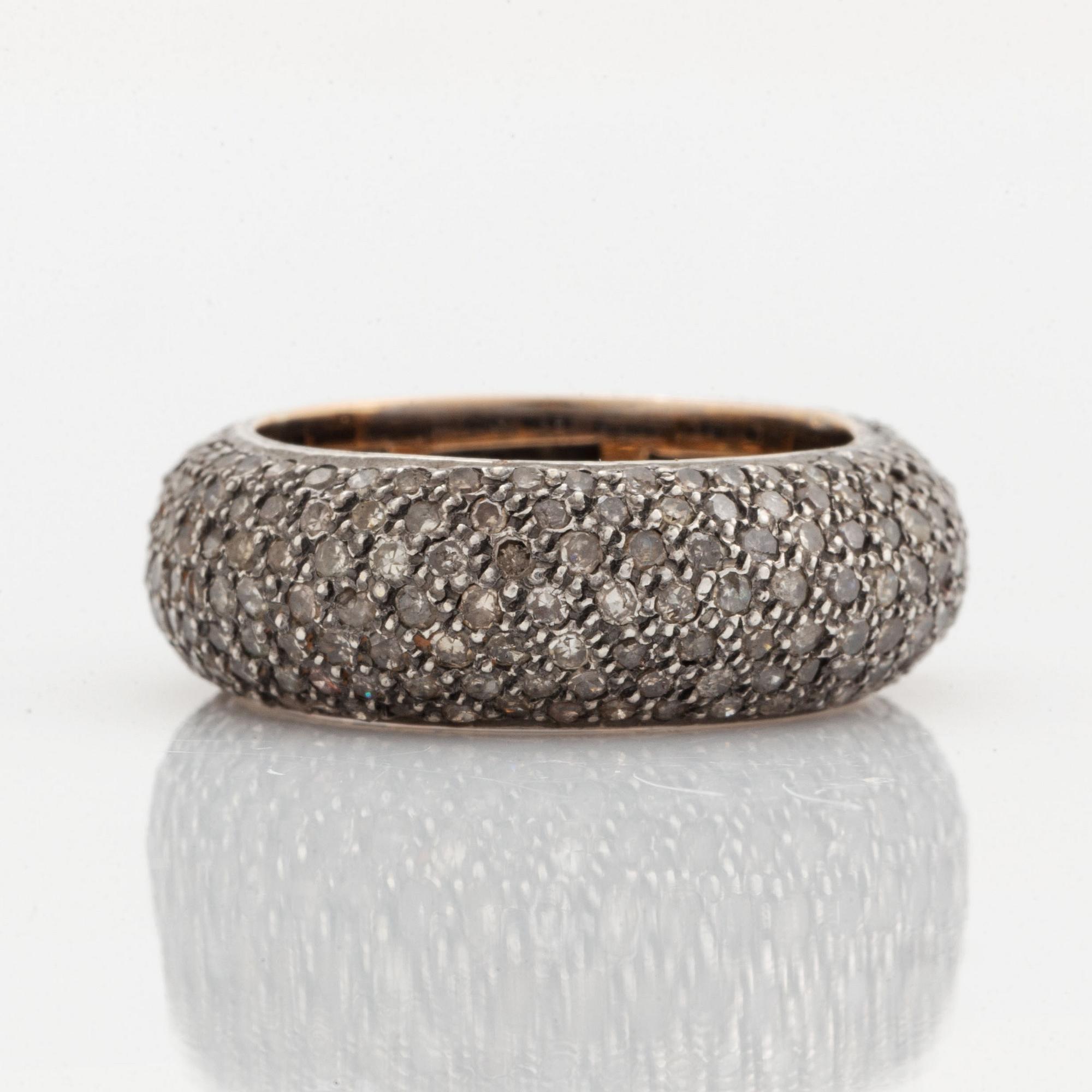 Silver and diamond ring.