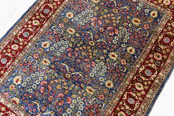 An Oriental silk rug, signed, c. 125 x 85 cm.