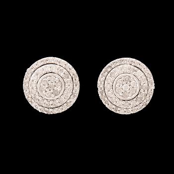 A pair of 14K white gold earrings set with round single-cut diamonds.