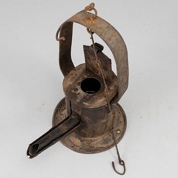 A 19th century tinplate oil lamp.