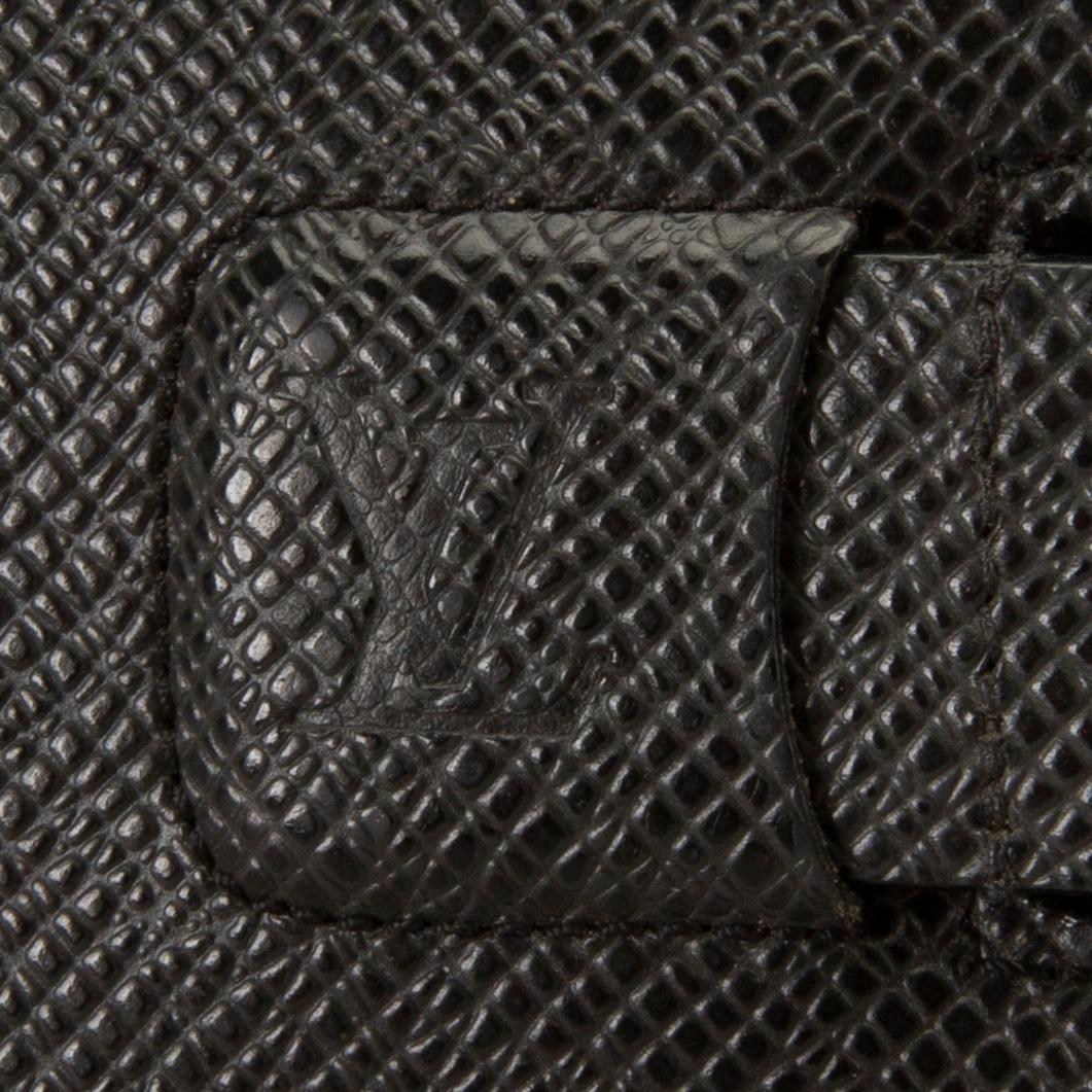 A Louis Vuitton palm pilot leather cover.