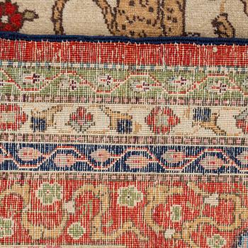 A CARPET, a semi-antique Tabriz, around 422 x 310 cm.