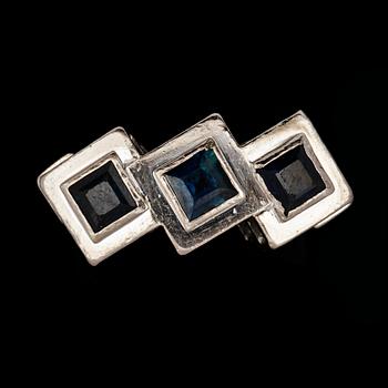 A blue sapphire ring.