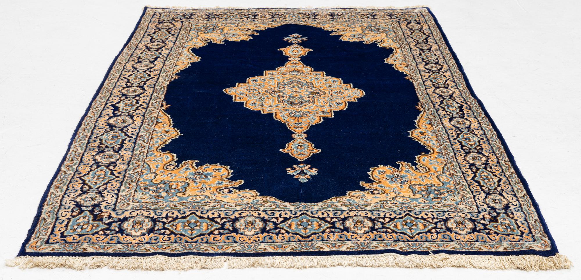 An old Kerman rug, ca. 249 x 148 cm.