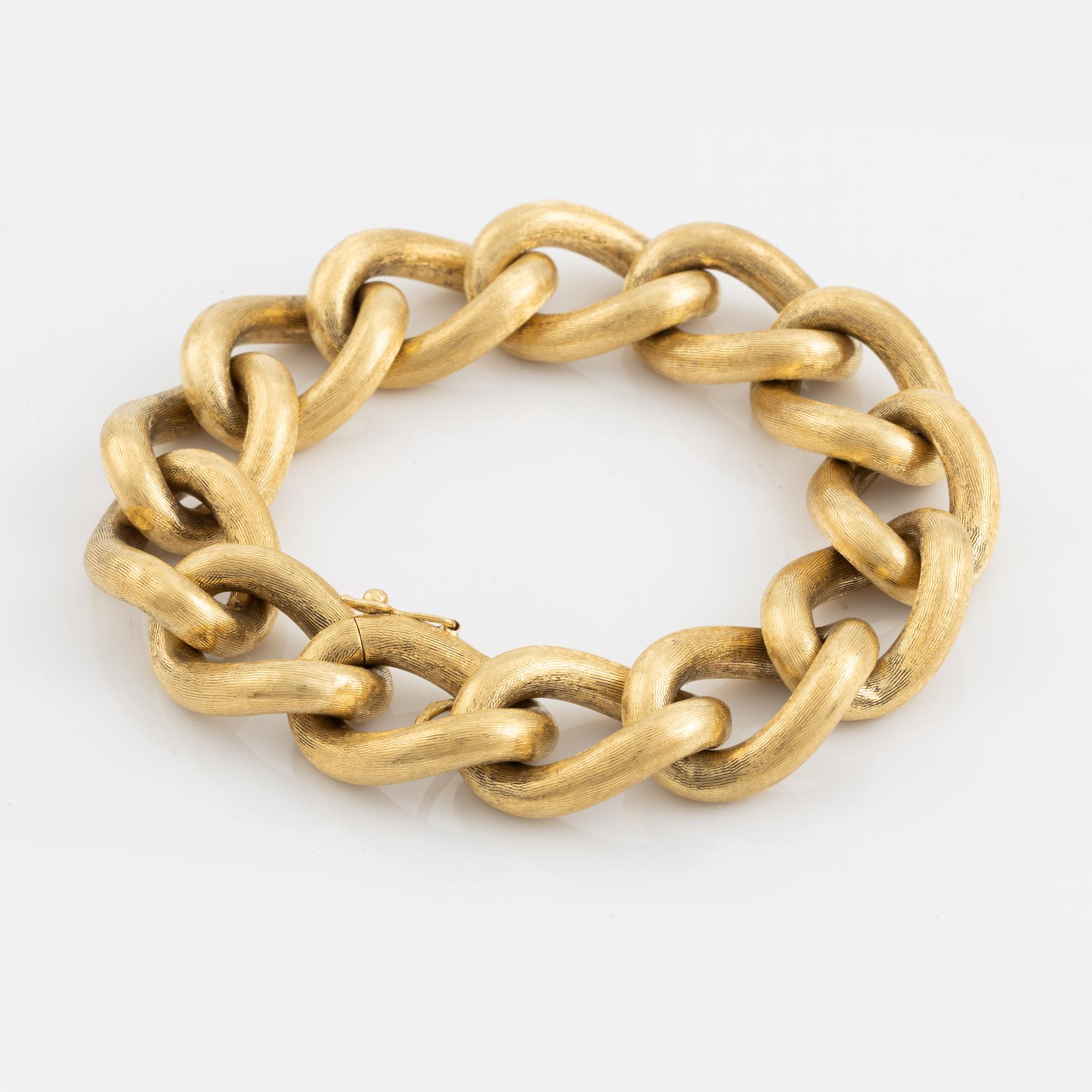 An 18K gold bracelet.