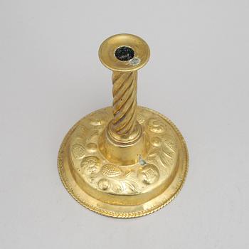 A 19th Century baroque style candlestick, with older parts.