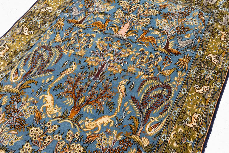 A Ghom figural rug, c. 202 x 132 cm.