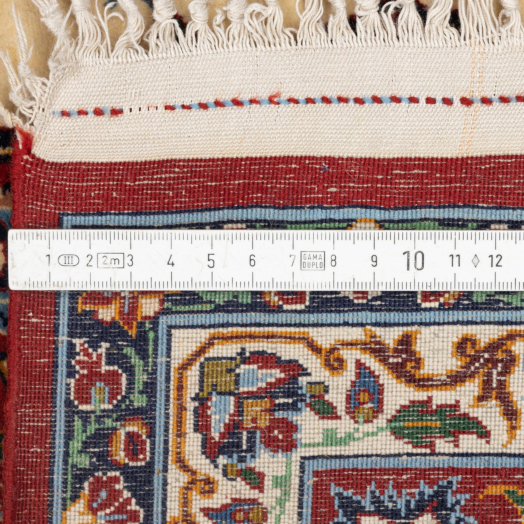 A semi-antique Isfahan rug, c. 225 x 143 cm.