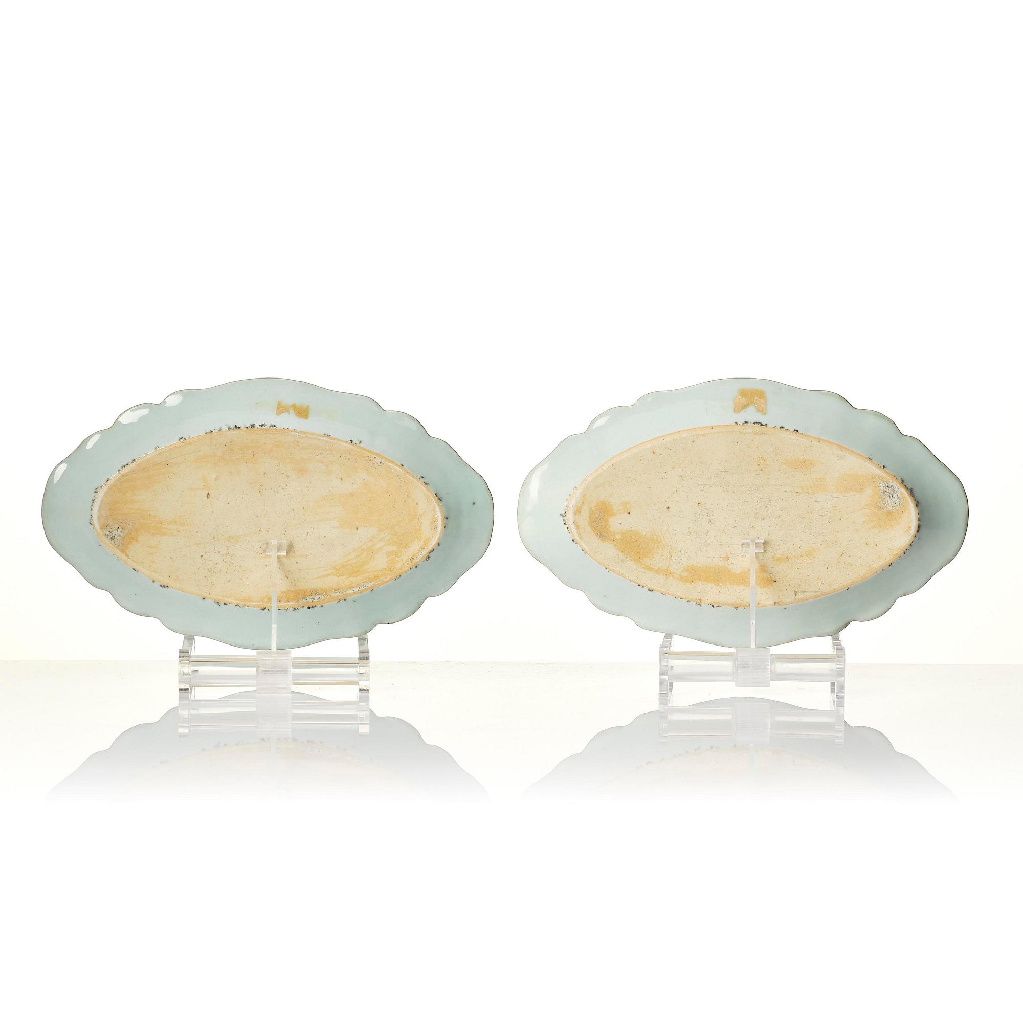 A pair of famille rose 'double peacock' dishes, Qing dynasty, Qianlong (1736-95).