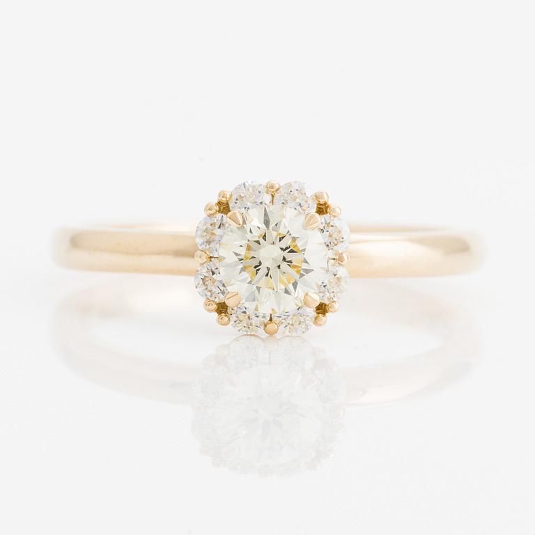 Ring with yellow brilliant-cut diamond.