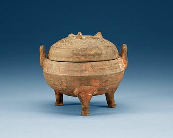 A potted ding tripod censer with cover, Han dynasty (206 BC - 220 AD).