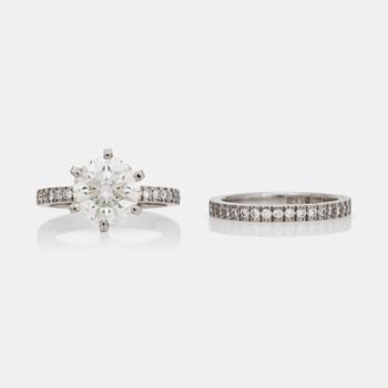 1212. Two rings, one with a brilliant-cut diamond circa 2.00 ct and an eternity ring with brilliant-cut diamonds.