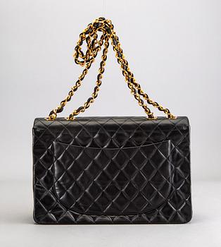 A Chanel maxi jumbo leather bag.